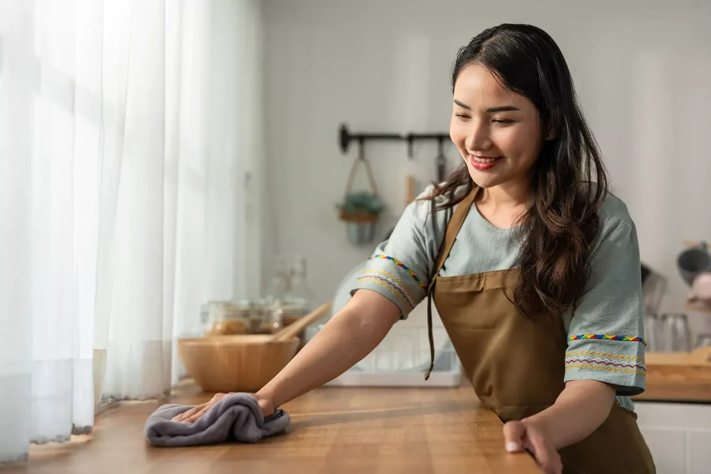 Woman wiping bench down
