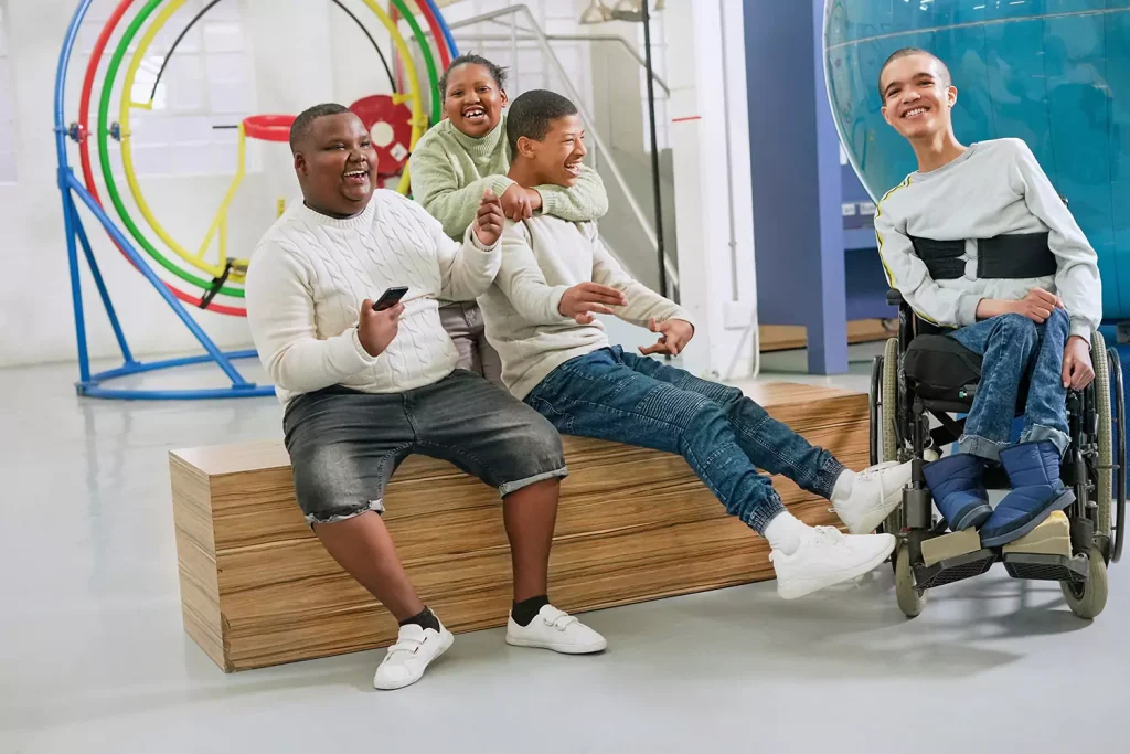 Group of disabled friends laughing and smiling